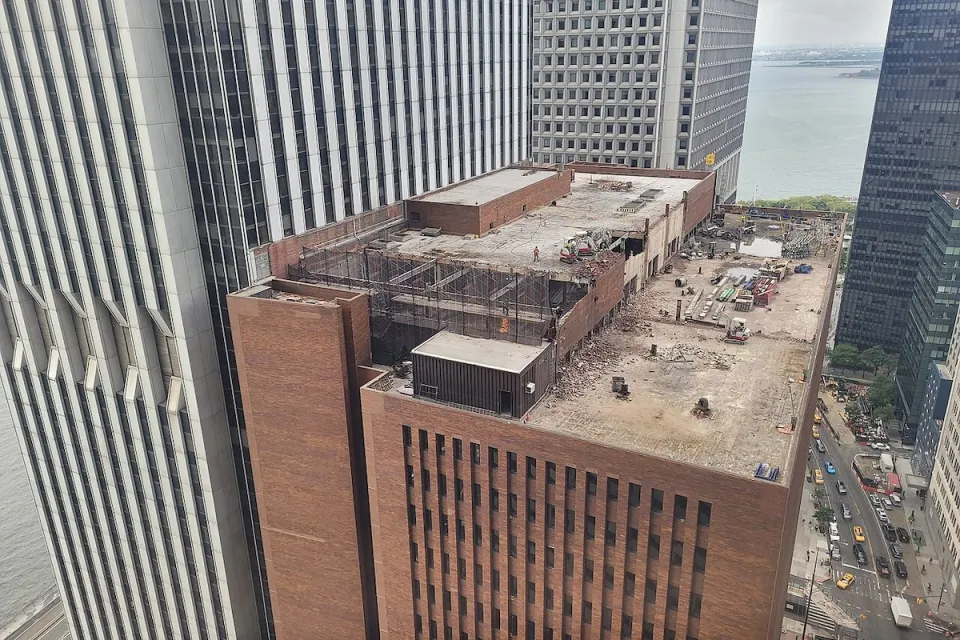 Aerial view of rooftop of 25 Water Street building in New York City with redevelopment work going on on rooftop.
